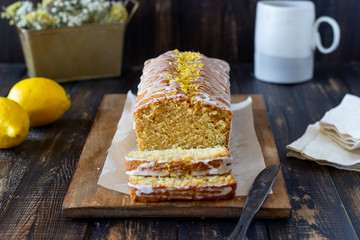 Homemade lemon cake on a wooden background. Recipe. Vegetarian food. Pastries.