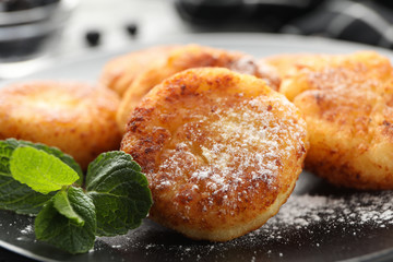 Plate with cheese pancakes, close up. Delicious breakfast