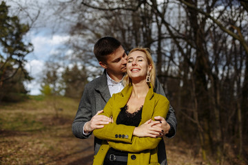 hugs of two lovers on a sunny day in the park