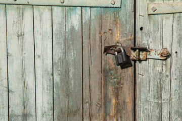Old wooden gate with Chain key lock