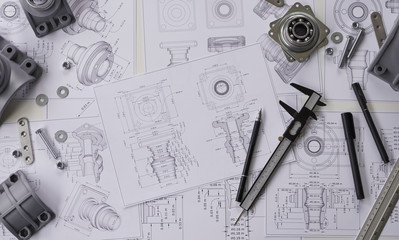 Engineer technician designing drawings mechanical parts engineering Engine.manufacturing factory...