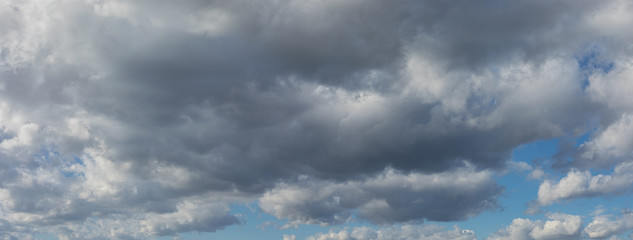 Beautiful blue sky background panorama at daylight with white cumulus clouds. Backgroud banner
