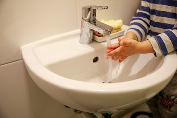 hands of a child during handwashing