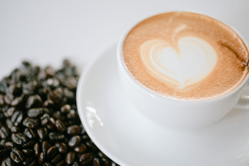 up of cappuccino coffee on wooden table background