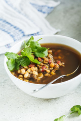 Vegetarian bean mix soup in a white bowl. Vegan food concept.