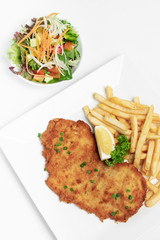 german breaded pork schnitzel with french fries
