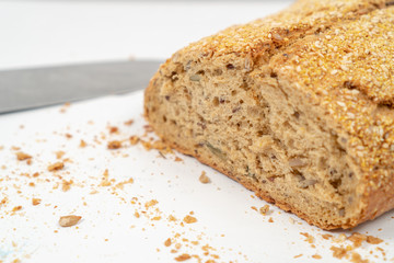 Sliced Bread With Sesame Seeds On The White Wooden Boards