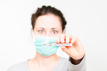 caucasian brunette woman in protective medical mask on face protection for spreading of disease...