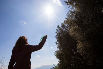 Girl freeing herself from the protective mask after overcoming illness, virus, covid-19. coronavirus