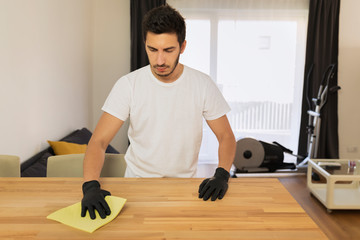 The husband helps his wife with household chores.