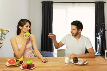 A man leads a wrong lifestyle, he eats sweet and high-calorie food for breakfast.