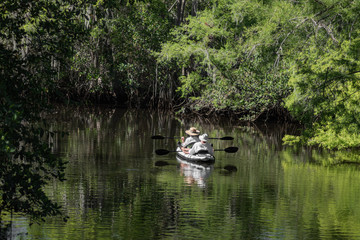 People enjoy canoeing on the river