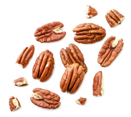 Peeled pecans with broken halves and pieces on a white background. The view from top. - obrazy, fototapety, plakaty