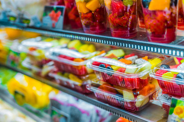 Packages with fruits displayed in a commercial refrigerator