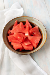 Watermelon fruit cutted in bowl on white background