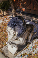 MARBLE LION IN FRONT OF THE HOUSE.