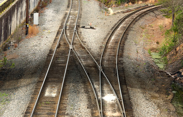 Railroad tracks diverging with a switch track.