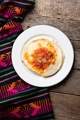 Mexican quesadilla with corn tortilla and piquant sauce also called 