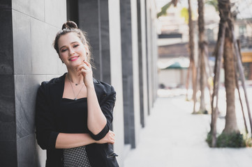 Portrait of a successful business woman smiling. Beautiful young female executive in an urban setting