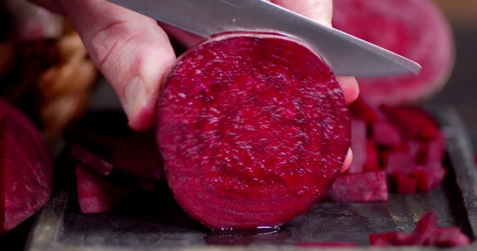 Sliced fresh beets on a cutting Board.