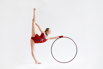 Graceful woman doing gymnastics with hoop on white background, blank space