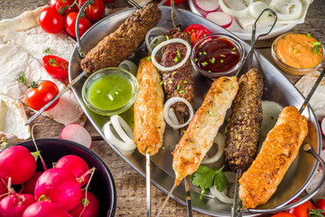 Summer bbq party. Shish kebab on a stick, from ground beef and chicken meat. Lula kebab,...