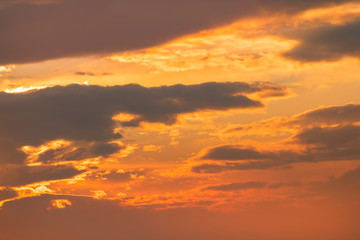 Beautiful colorful bright sunset sky with orange clouds. Nature sky background. 