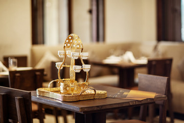 Arabic tea set is on a tray on the table in the cafe. Set prepared for the tea ceremony