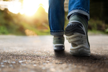 Life and Challenging Concept. Low Section of Motivated Young Man Walking in Outdoor. Natural...