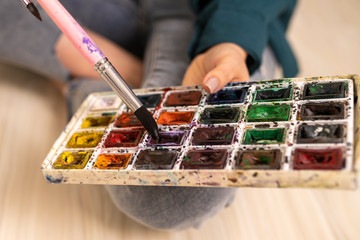 watercolor paints close up in hands