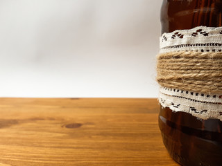 Bottle on a wooden table.