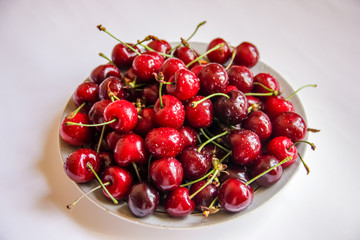 Obraz na płótnie Canvas cherry berries close up macro in white