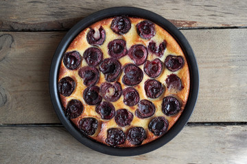 Fresh baked cherry clafoutis in baking dish