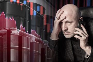 Upset. The man was told the bad news. Concept is chagrin due to falling oil prices. The concept is...