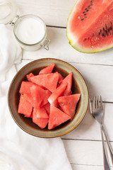 Watermelon fruit cutted in bowl on white background