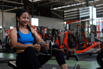 Fototapeta premium Asian woman in fitness gym