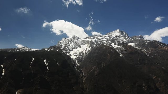 Time lapse of clouds passing over rugged Himalayan mountains