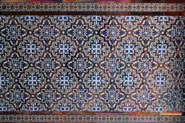 Close-up: sample of a typical Andalusian / Moorish tile pattern in a house entrance; Spain, Europe