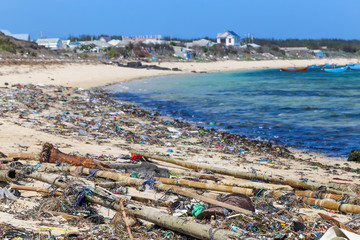 A huge amount of plastic trash thrown onto an Asian beach.