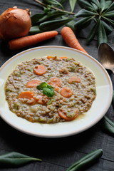 Plate of cooked lentils with carrot