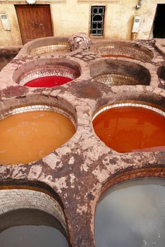 Close-up of colorful dyeing basins of the tanneries in the medina of Fes, Morocco, Africa
