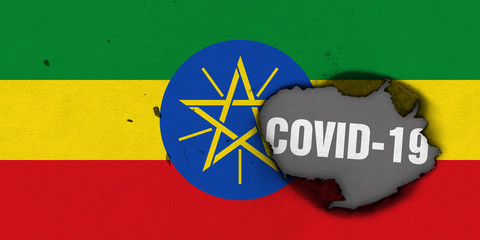 Flag of Ethiopia with burned out hole showing Coronavirus name in it. 2019 - 2020 Novel Coronavirus...