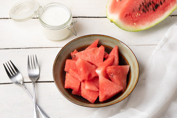 Watermelon fruit cutted in bowl on white background