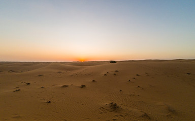 UNITED ARAB EMIRATES Dubai, UAE - Desert red sand isolated the sand dunes. Sunset in the desert