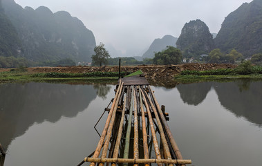 typical vietnamese boat and cane pier in landscape