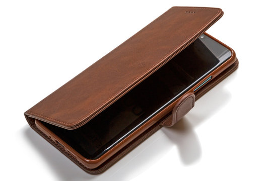 Smartphone in a case on white