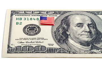 $100 dollar bill and tiny volumetric flag