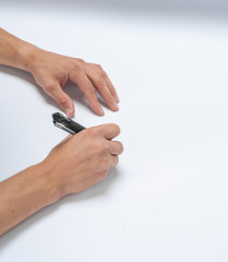 Male hand writes a black pen on white paper