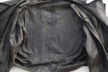 background of an old black leather jacket