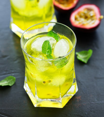 Cold drink with passion fruit and mint. Selective focus